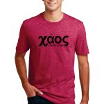 Man wearing a red t-shirt with the word "xáos" and the phrase "CREATE SOME." in black text. He is smiling and has short, dark hair. The shirt is paired with dark jeans.