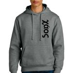 A person wearing a gray hoodie with the word "XAÓS" printed vertically in black on the left side, paired with blue jeans. The hoodie has a front pocket and drawstrings.